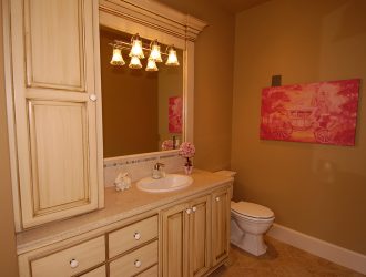 Cream colored wooden bathroom vanity